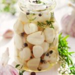 Pickled garlic with spices and herbs